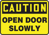 Accuform Signs MABR603VS  7'' X 10'' Black And Yellow 4 mils Adhesive Vinyl Admittance And Exit Sign ''CAUTION OPEN DOOR SLOWLY'' (1/EA)