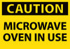 NMC C180AP-CAUTION, MICROWAVE OVEN IN USE, 3X5, PS VINYL (PAK OF 5)